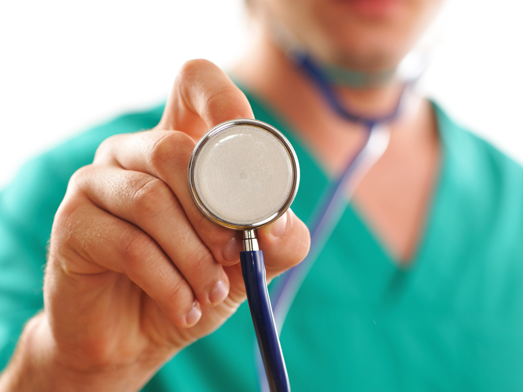 Doctor holding stethoscope (with shallow depth of field)